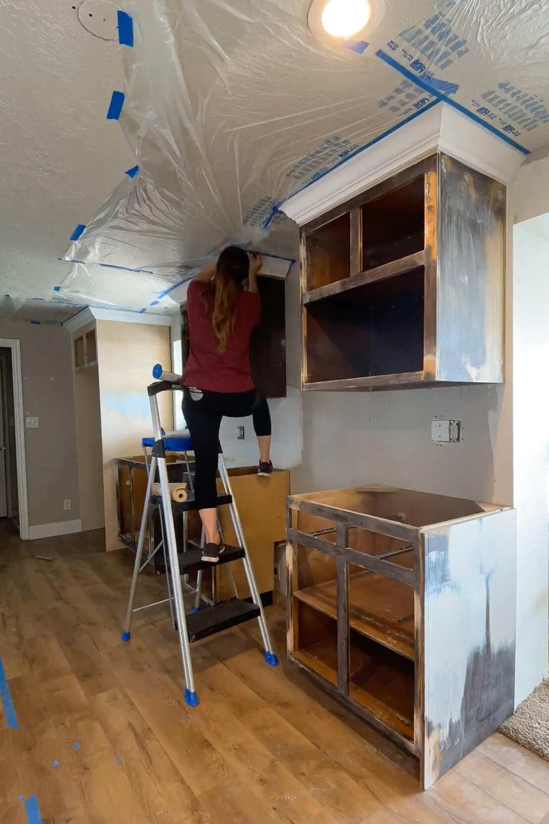 Masking a kitchen to get ready for paint.